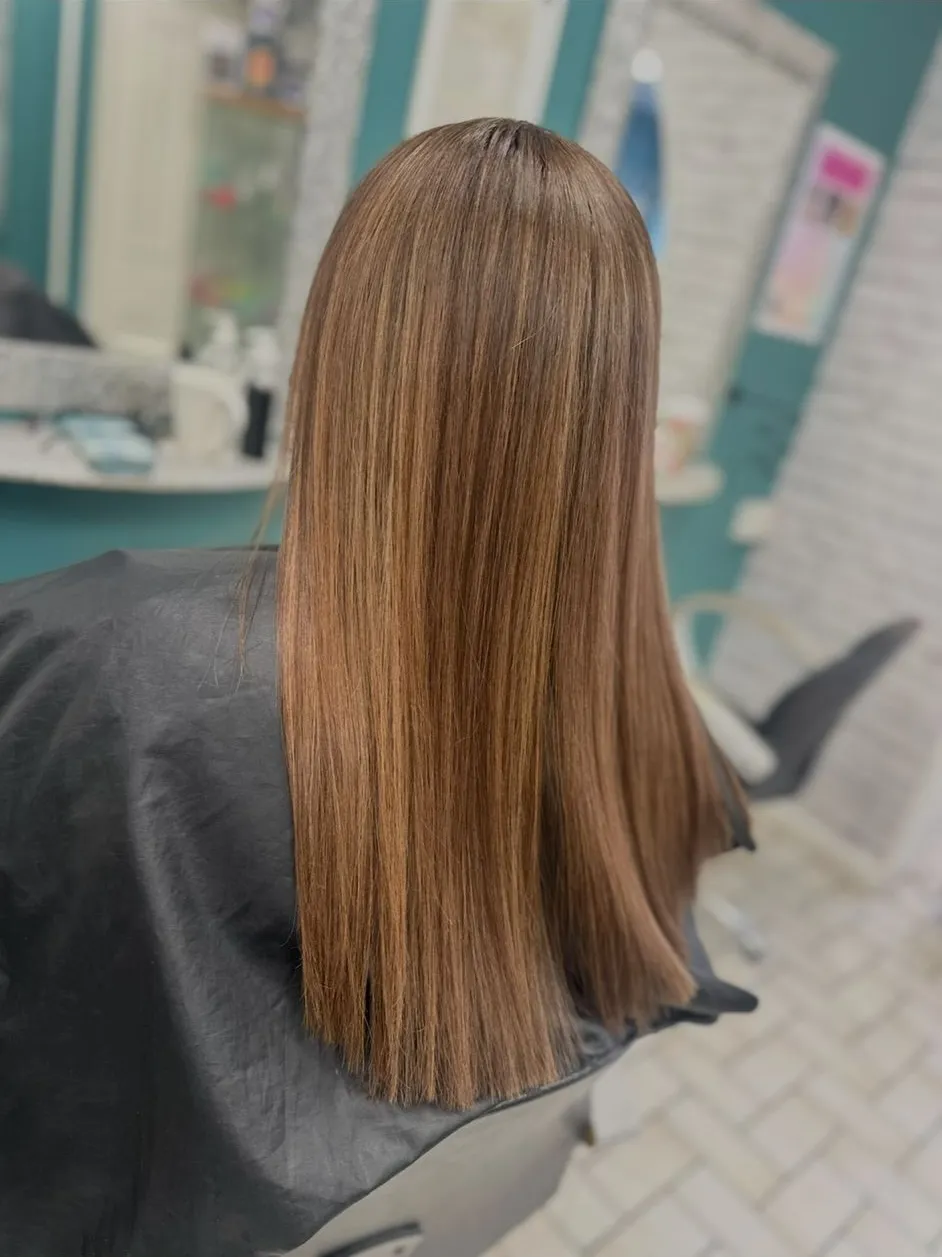 Smooth straight medium brown hair with subtle warm highlights