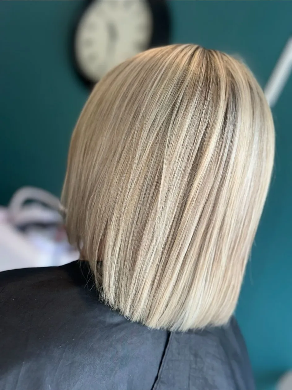 Ash blonde highlighted bob with a clean blunt finish
