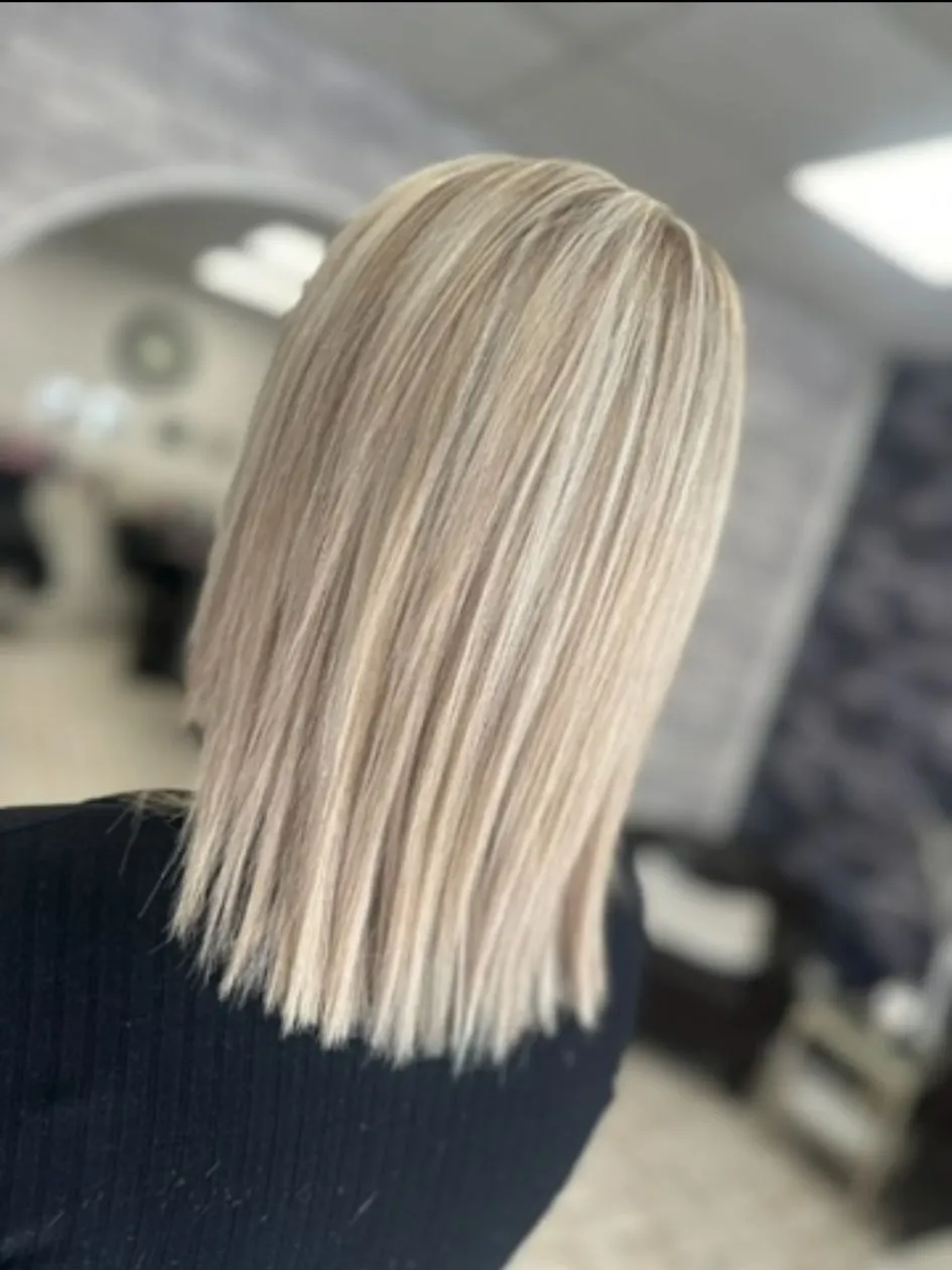 Cool-toned platinum blonde long bob with a soft blunt cut